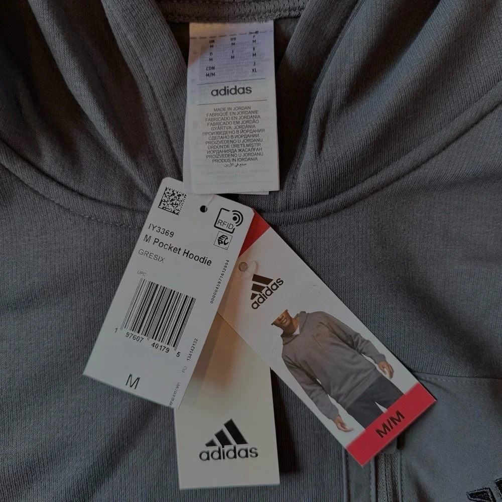 NWT Adidas men’s size medium gray hoodie with pockets.